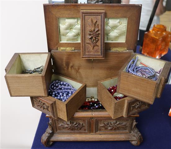 A Black Forest jewellery box and a quantity of costume jewellery.